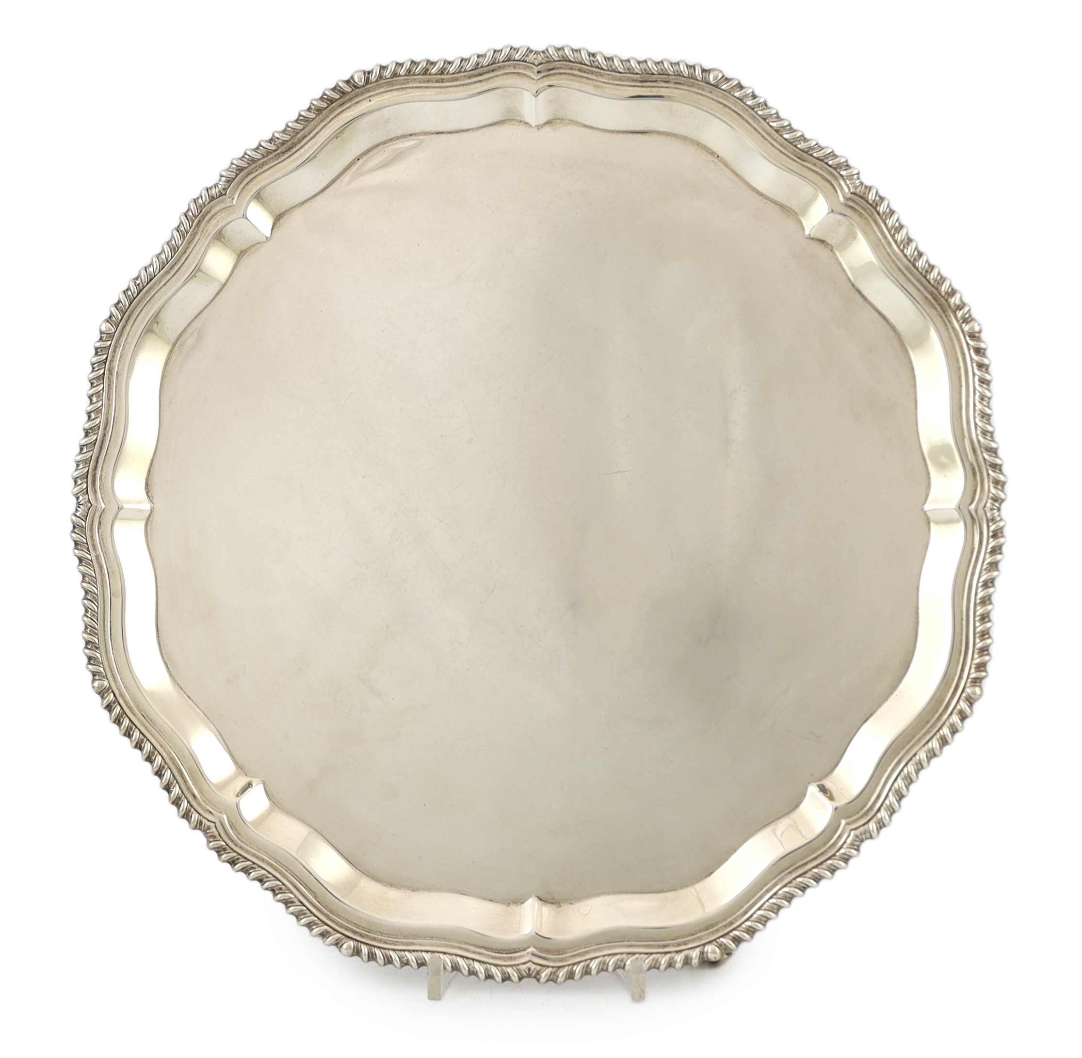 A Far Eastern white metal oval tray, with gadrooned and beaded rim, stamped silver, 45cm
